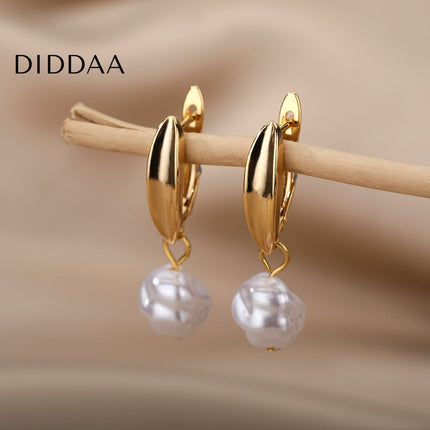 Detente Earrings | Gold Pearl Luxury Drop Earrings - Gold - Earrings