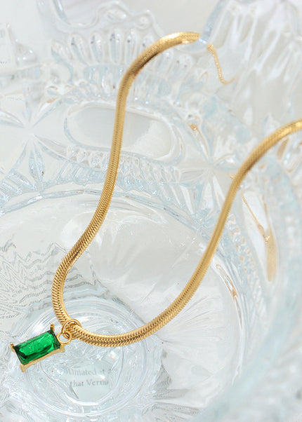 Japanese and Korean style niche design sense titanium steel gold-plated snake bone chain retro style light luxury emerald zircon pendant necklace