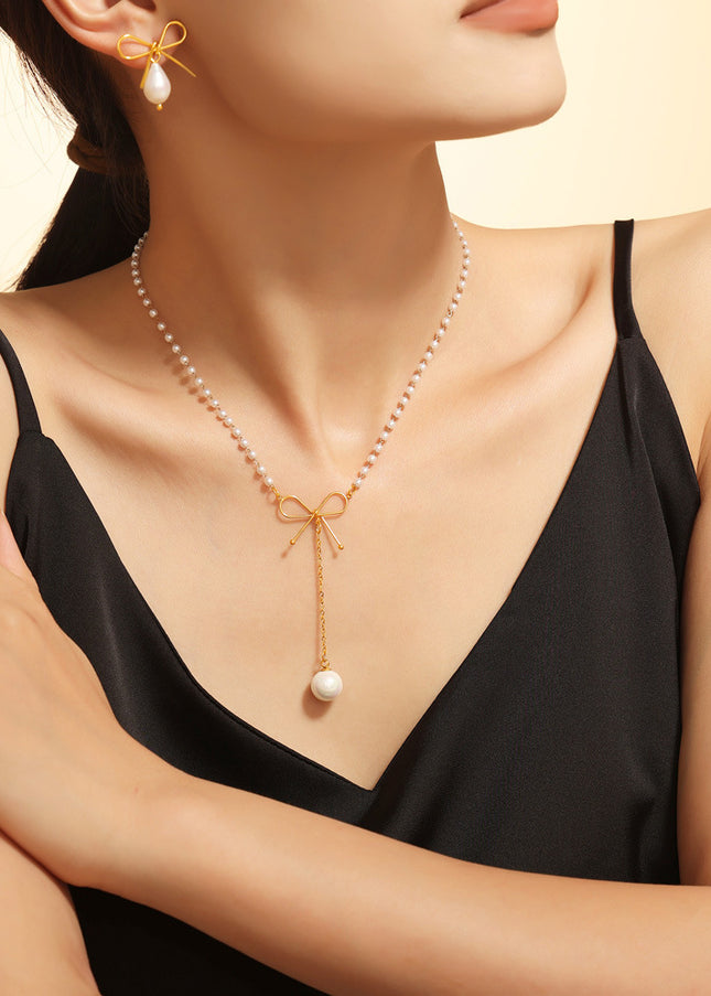 Fairy choker bow imitation pearl necklace ins cold style temperament simple luxury stainless steel clavicle chain