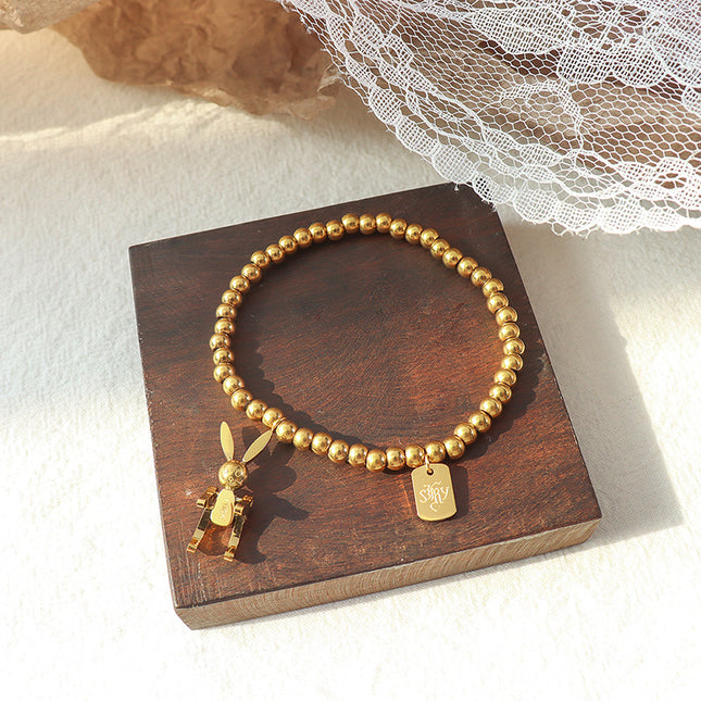 European and American ins light luxury style simple rabbit titanium steel bracelet plated 18k gold fashion elastic rope bead bracelet E024