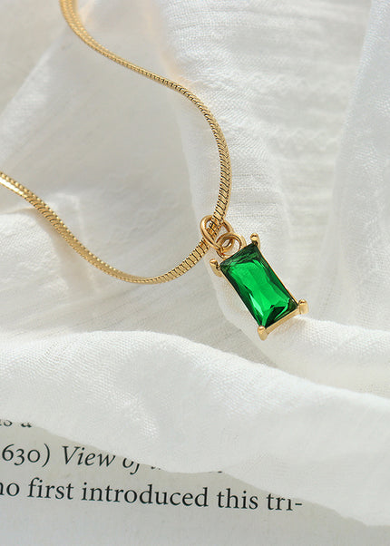 Japanese and Korean style niche design sense titanium steel gold-plated snake bone chain retro style light luxury emerald zircon pendant necklace