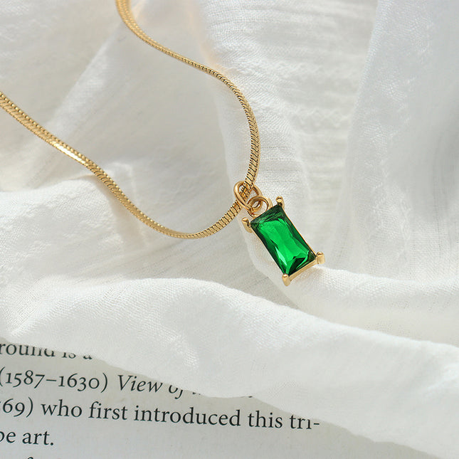 Japanese and Korean style niche design sense titanium steel gold-plated snake bone chain retro style light luxury emerald zircon pendant necklace
