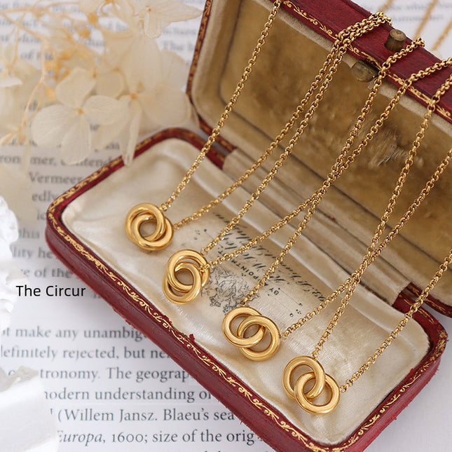 European and American cross-border new high-end light luxury personality design round titanium steel gold-plated interlocking pendant necklace women
