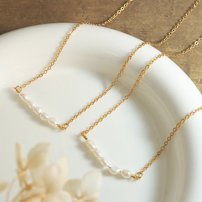 Korean version of simple and fashionable temperament freshwater pearl necklace women's ins cold wind light luxury titanium steel plated 18k gold clavicle chain