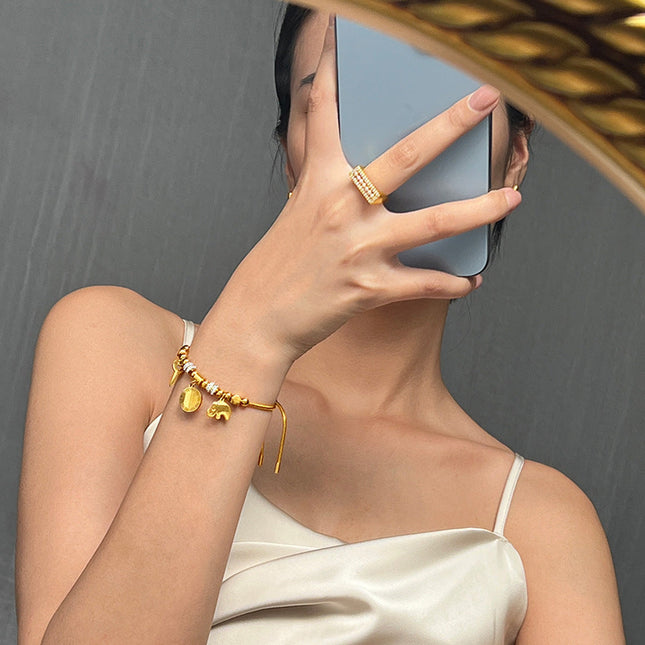 Cross-border hot-selling personality niche pull-out buckle jewelry, multi-element pendant, diamond-encrusted design, titanium steel gold-plated bracelet