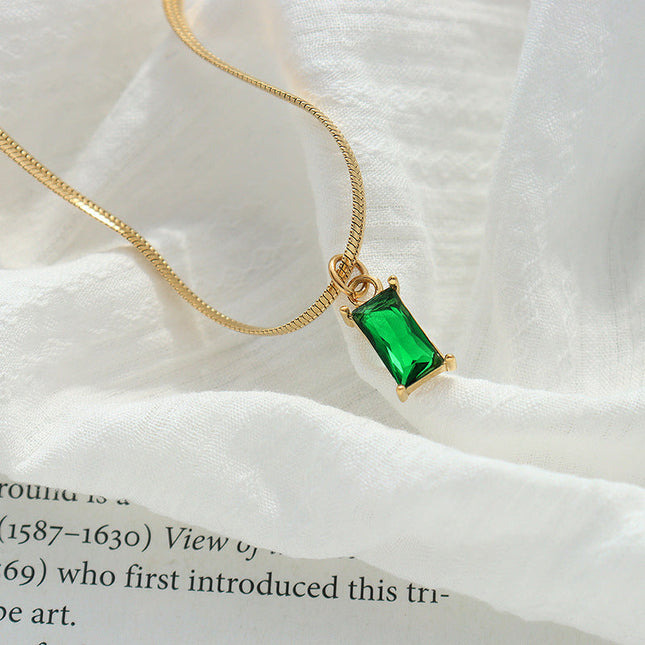 Japanese and Korean style niche design sense titanium steel gold-plated snake bone chain retro style light luxury emerald zircon pendant necklace