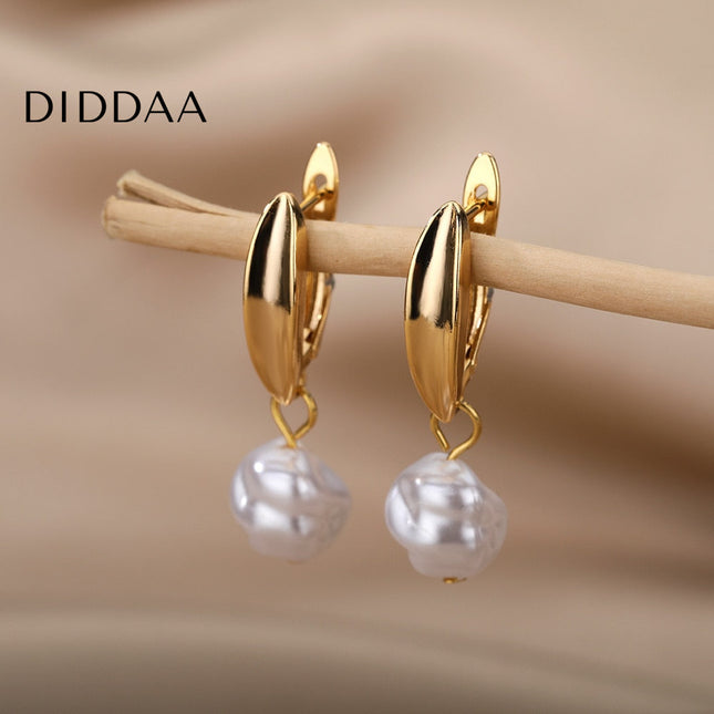 Detente Earrings | Gold Pearl Luxury Drop Earrings - Gold - Earrings