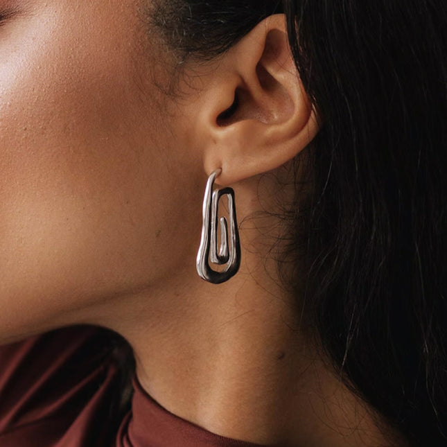 Jieding European and American stainless steel spiral earrings, women's light luxury, high-end earrings, design sense, niche earrings, titanium steel jewelry