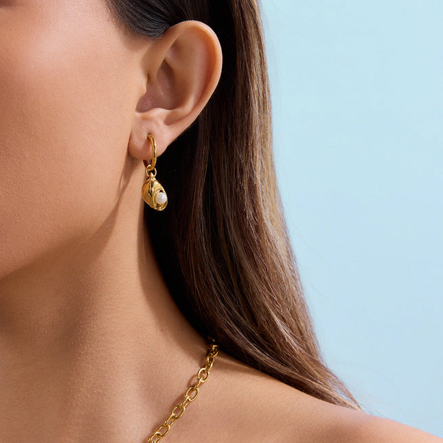 Jieding European and American stainless steel pearl earrings, light luxury, high-end earrings, conch titanium steel jewelry, cross-border earrings