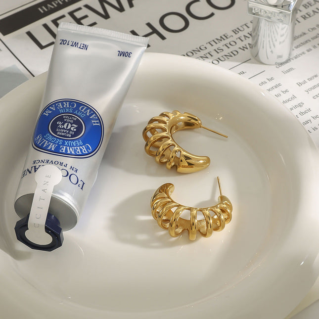 Jieding Europe and America 18k hollow titanium steel earrings light luxury high-end earrings do not fade ear jewelry stainless steel cross-border