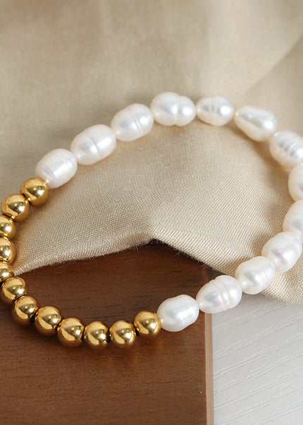 The new light luxury and versatile high-end natural freshwater pearl hand-beaded titanium steel gold-plated bracelet jewelry of the Queen Mother of the West