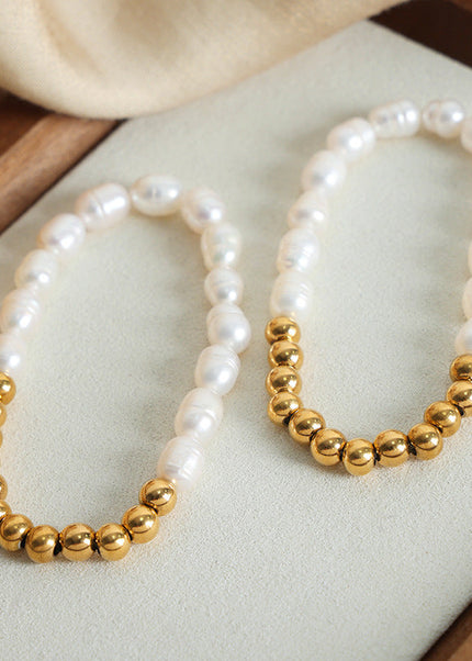 The new light luxury and versatile high-end natural freshwater pearl hand-beaded titanium steel gold-plated bracelet jewelry of the Queen Mother of the West