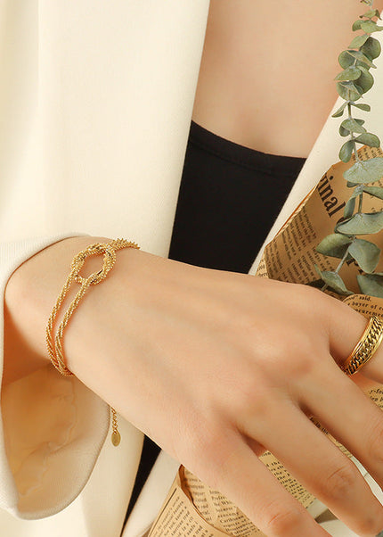 Korean ins cross geometric knotted bracelet women's niche design sense titanium steel gold-plated non-fading hand jewelry