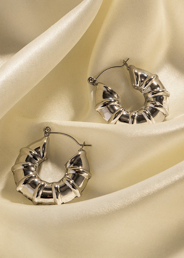 INS European and American new titanium steel earrings women's fashion versatile stainless steel winding hoops retro hollow earrings earrings