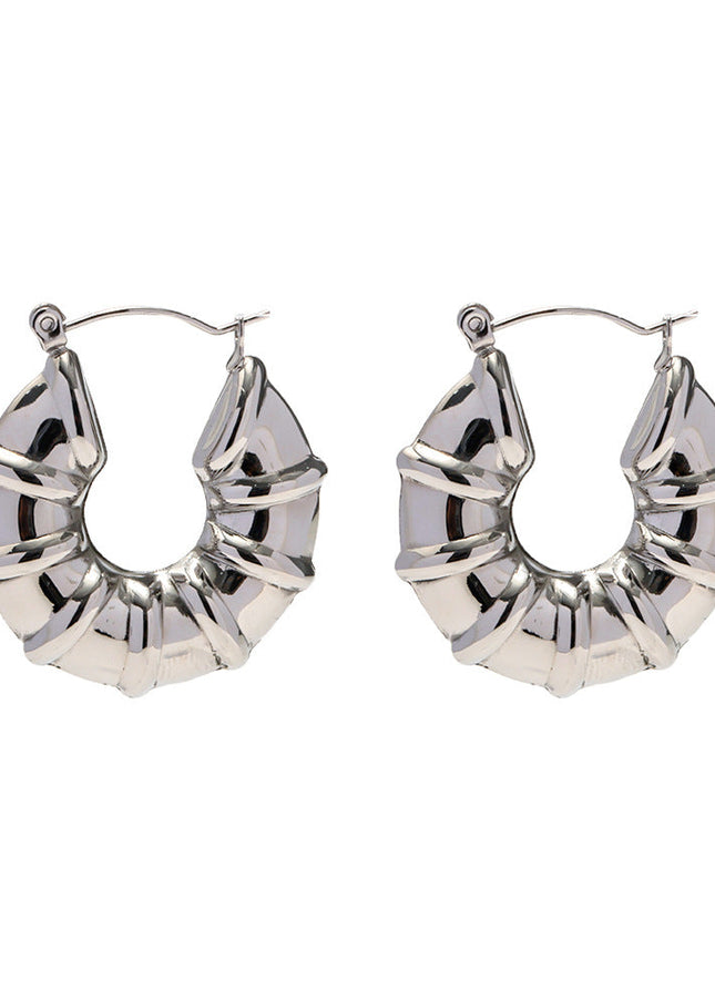 INS European and American new titanium steel earrings women's fashion versatile stainless steel winding hoops retro hollow earrings earrings